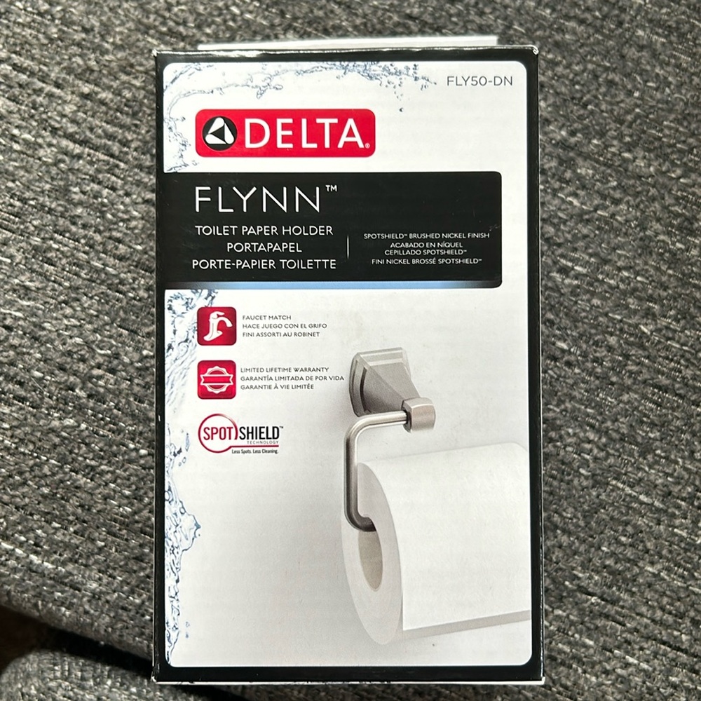 Brand new Delta toilet paper holder.